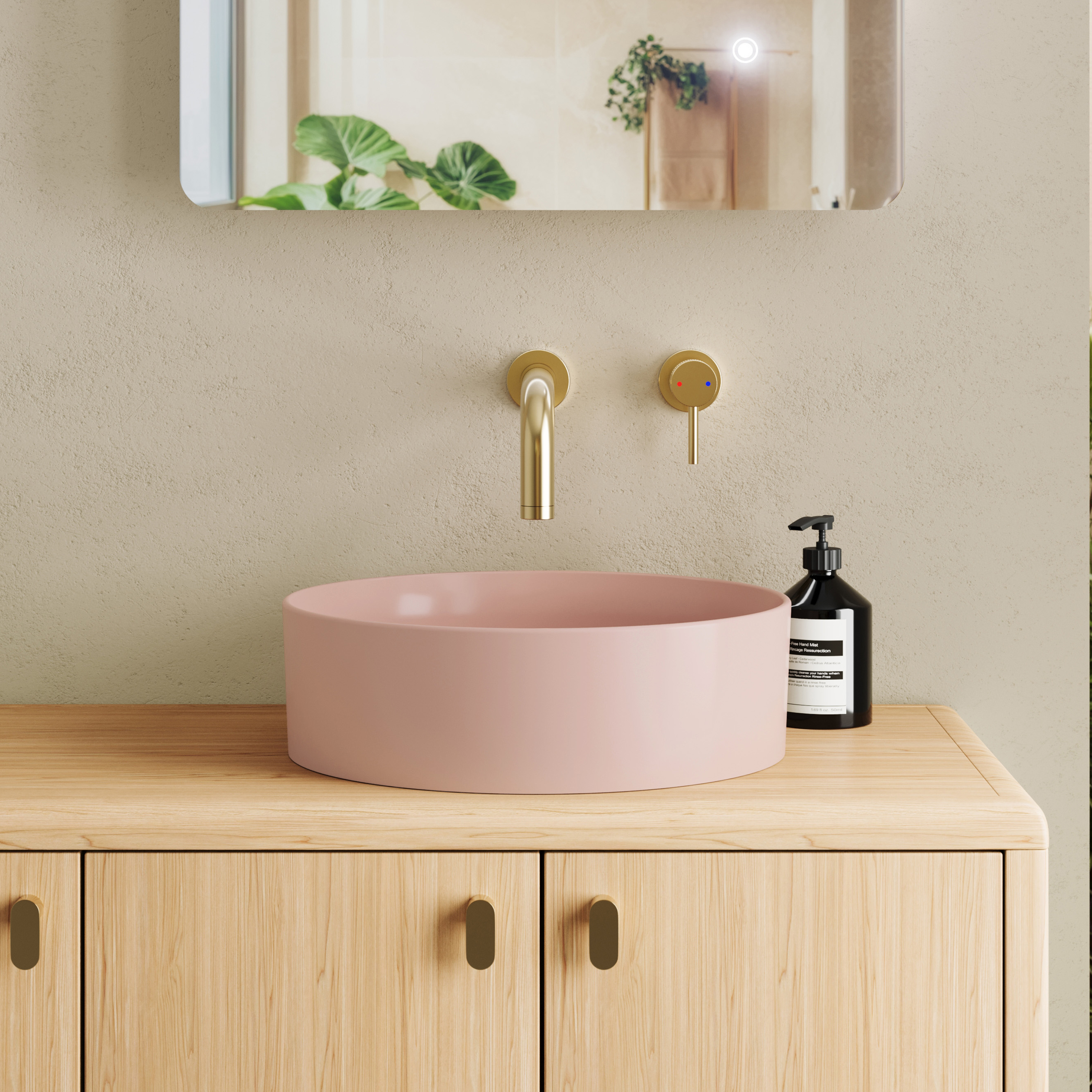 pink basin on wood unit